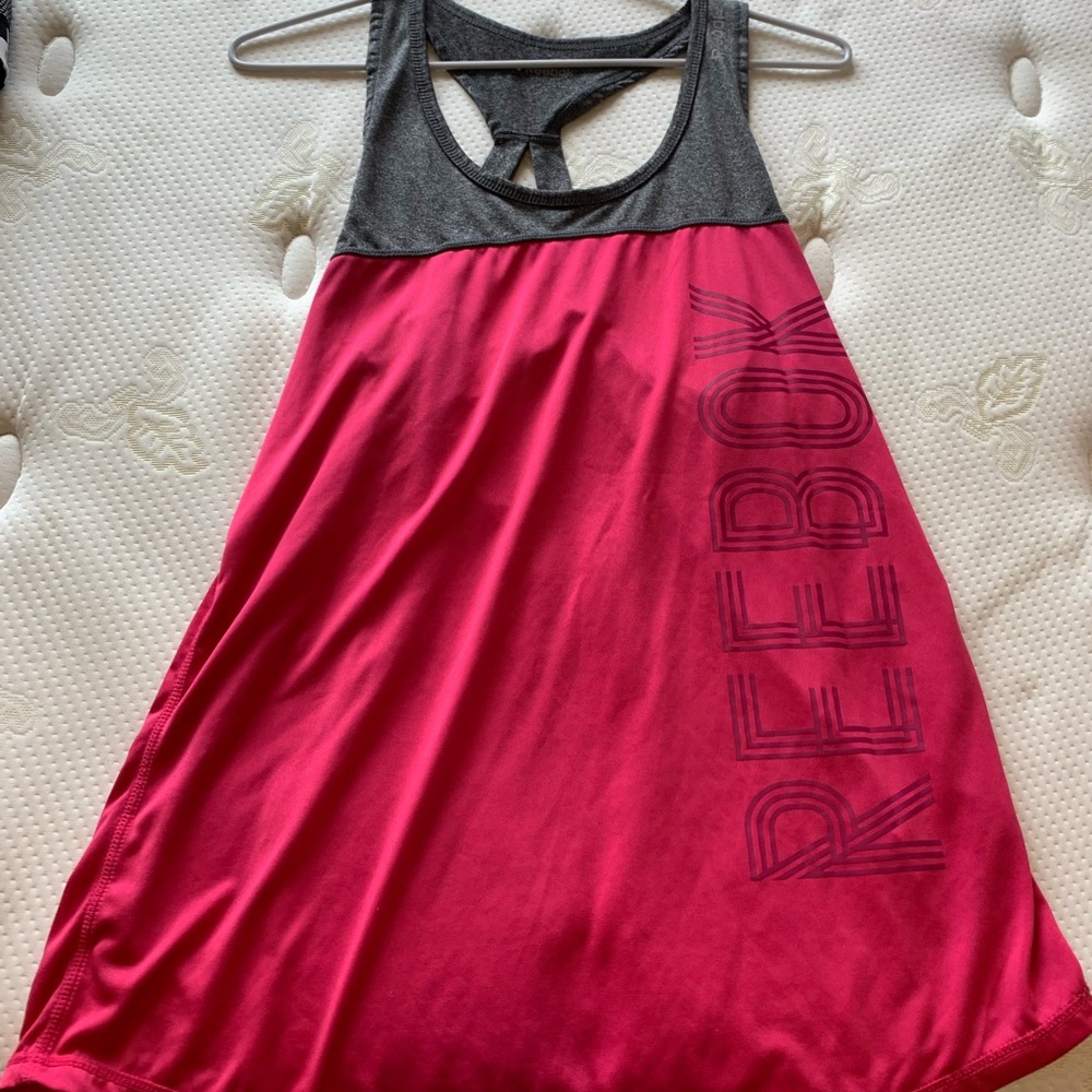 large pink Reebok workout shirt